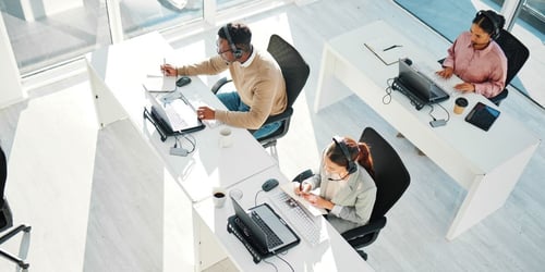 a office full of it desk help workers