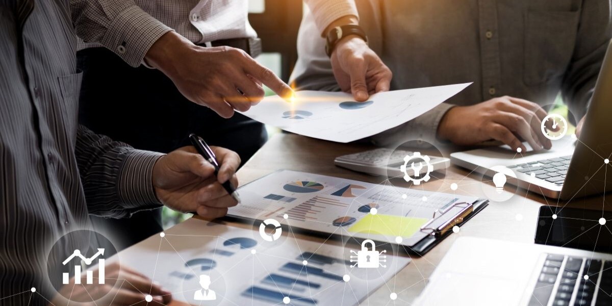 Business team reviewing office technology strategy and IT planning during a workplace meeting