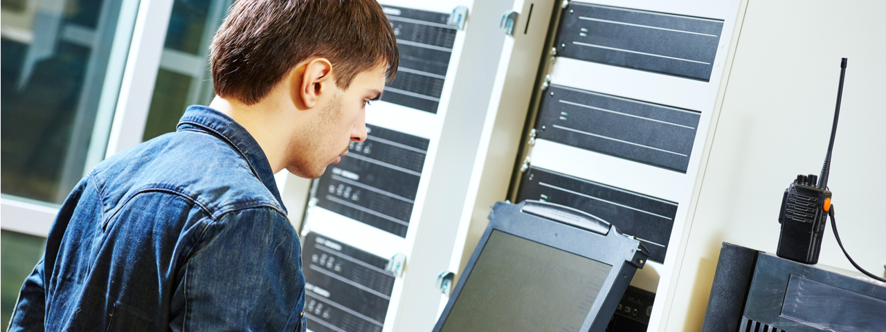Infrastructure and Network Support IT worker in server room