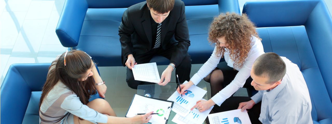 Remove Barriers to Growth Office people talking about financial graphs